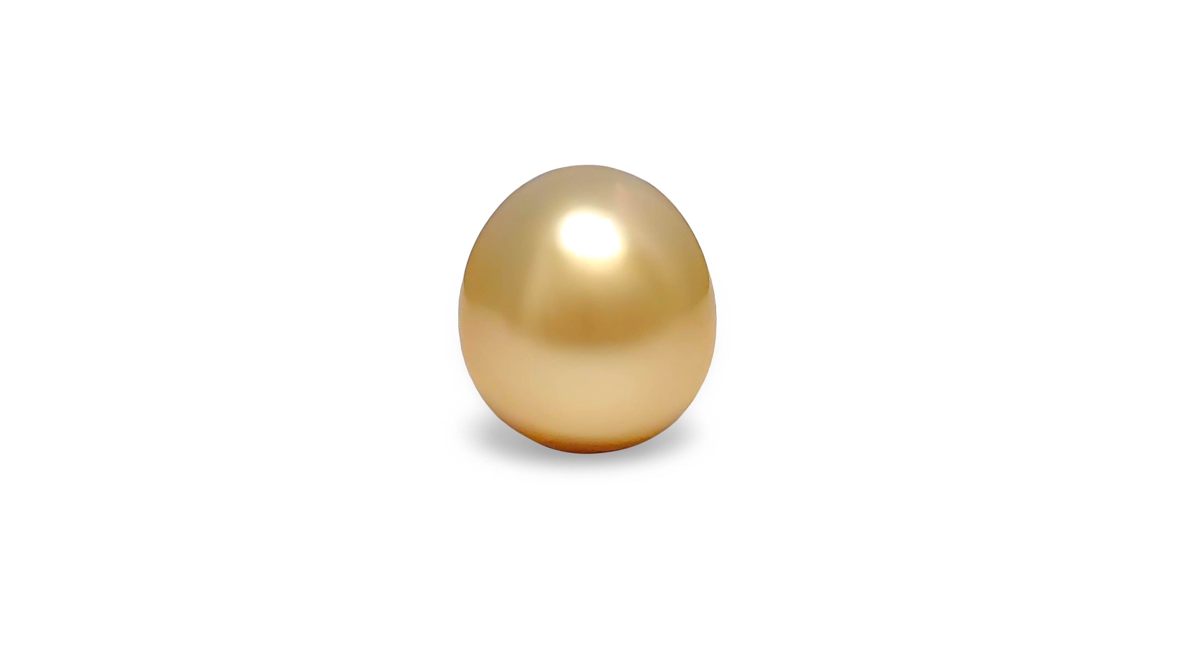 An oval shape golden South Sea pearl is displayed on a white background.