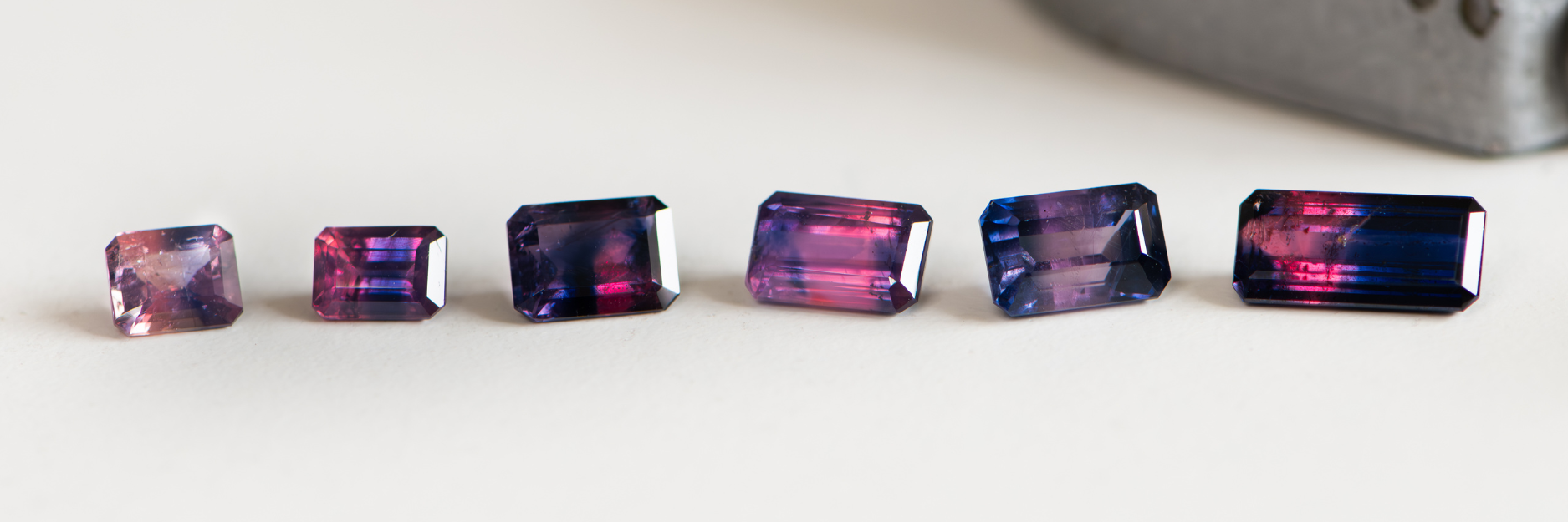 A small parcel of vibrant pink and deep blue Winza sapphires
