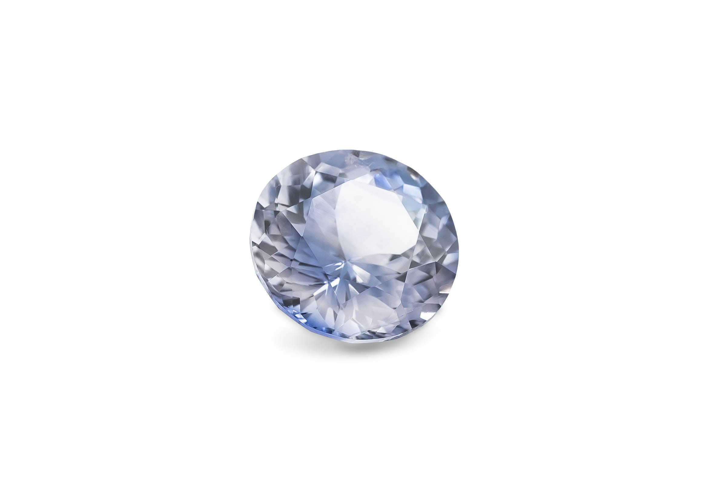 A unique round brilliant cut white and blue Ceylon sapphire gemstone is displayed on a white background.