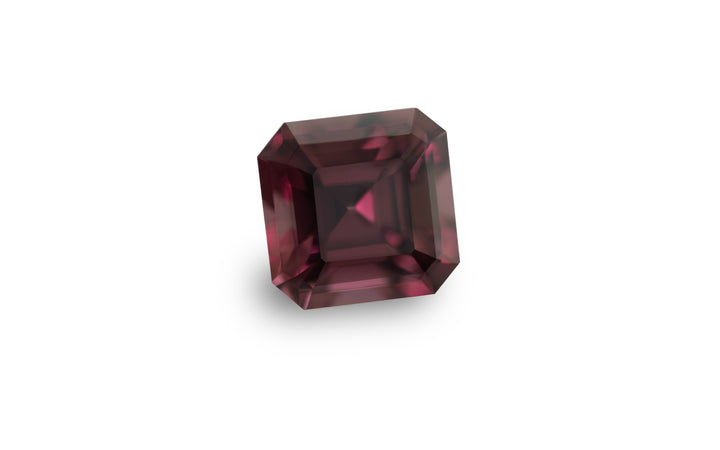 A square emerald cut pink tourmaline gemstone is displayed on a white background.