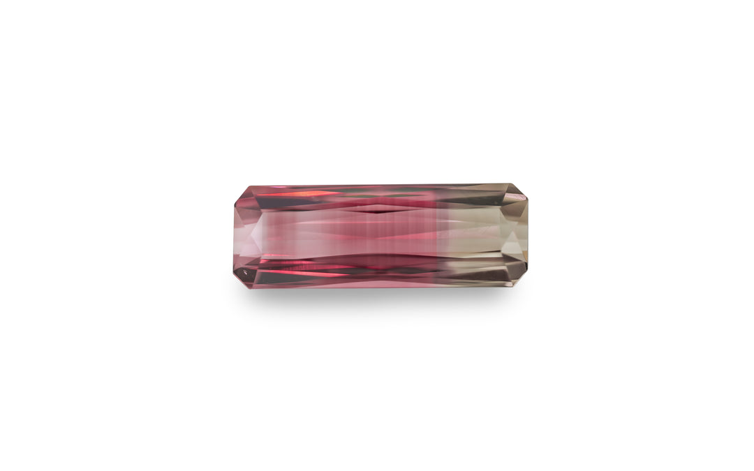 A radiant cut bi-colour pink and smoky brown tourmaline gemstone is displayed on a white background.