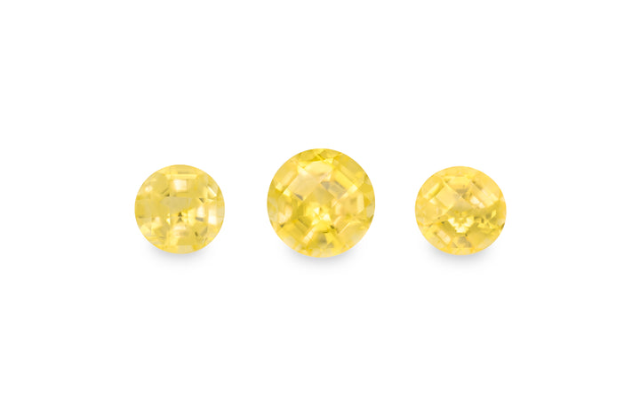 A set of yellow round brilliant cut sapphire gemstones is displayed on a white background.