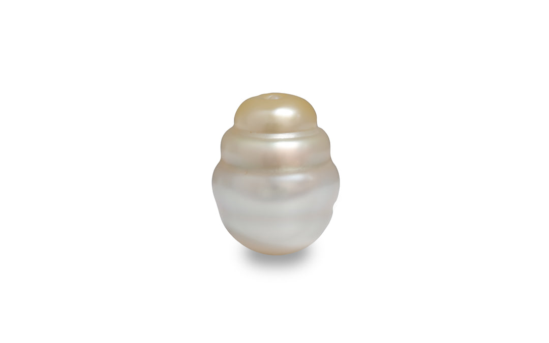 A baroque shape gold white South sea pearl pair is displayed on a white background.