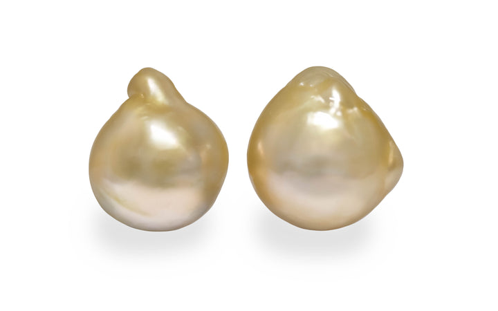 A baroque shape Golden South Sea pearl pair is displayed on a white background.