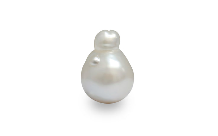 A baroque shape white cream South Sea pearl is displayed on a white background.