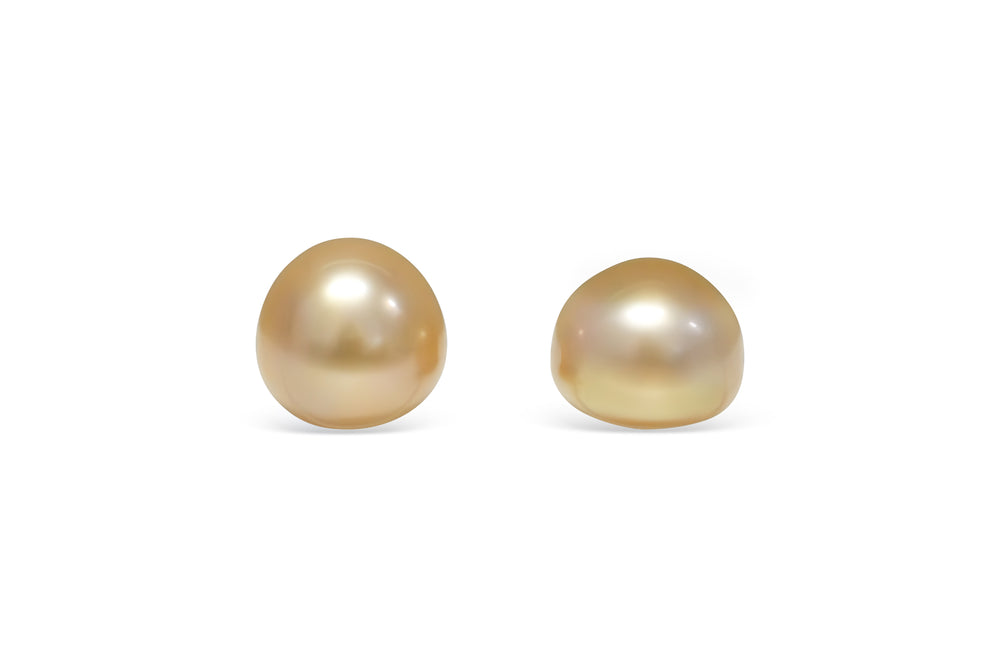 A button shape deep Golden South Sea pearl pair is displayed on a white background.