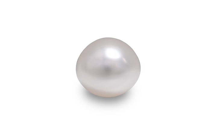A button shaped white South Sea pearl is displayed on a white background. 