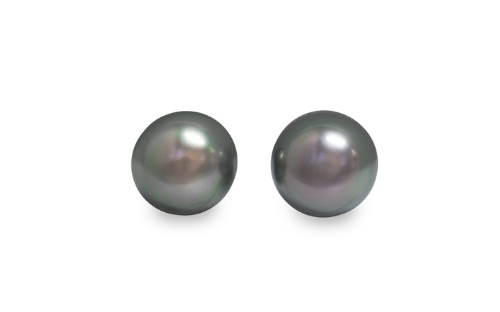 A pair of circle shaped Tahitian pearl pair gemstone is displayed on a white background.