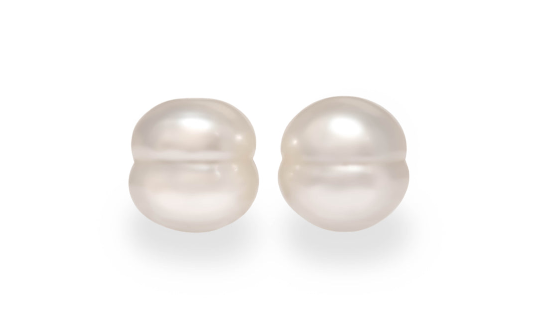 A circle shape white South Sea pearl pair is displayed on a white background.