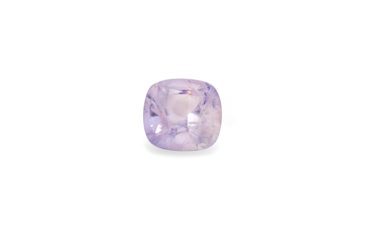 A cushion cut purple Burmese sapphire gemstone is displayed on a white background.