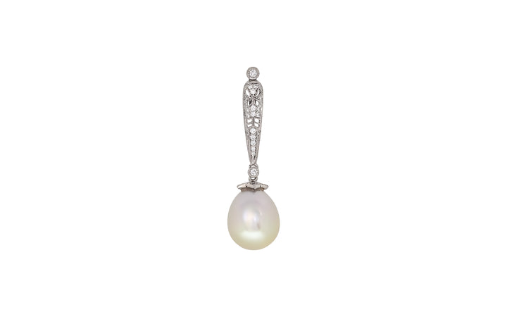 A drop shape cream white South Sea pearl diamond pendant in 18k white gold is displayed on a white background.