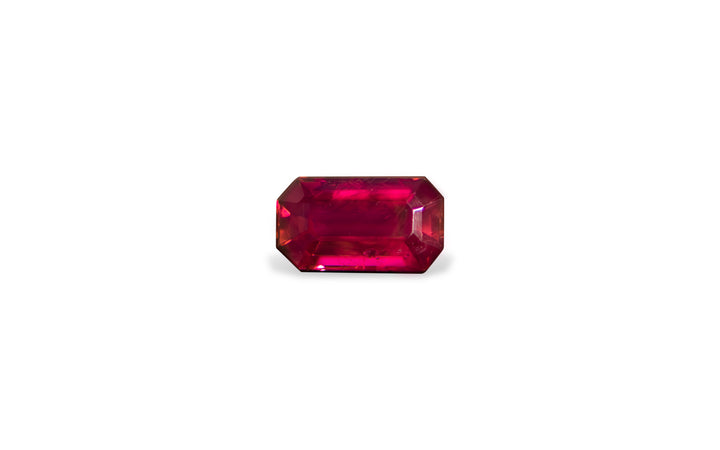 A emerald cut African ruby gemstone is displayed on a white background.