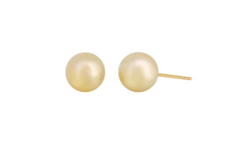 A pair of golden south sea pearl 18k yellow gold stud earrings is displayed on a white background.
