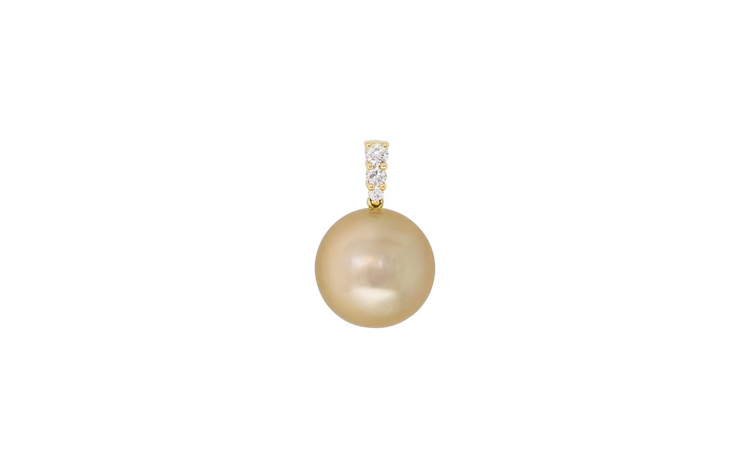 A high button shape golden South Sea pearl diamond pendant in 18k yellow gold is displayed on a white background. 