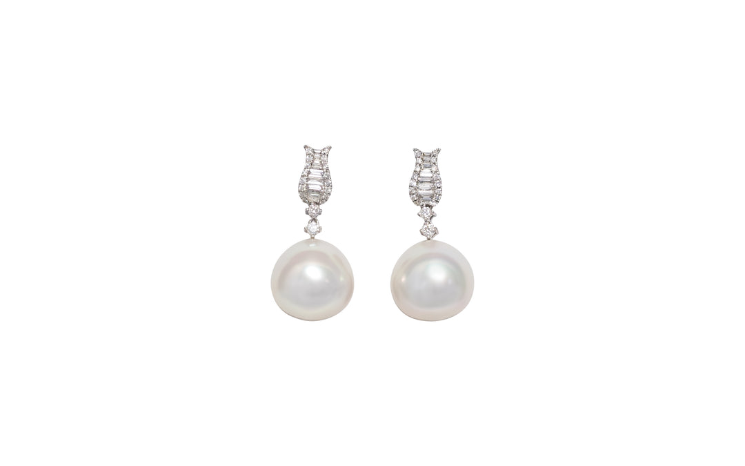 A high button pink white South Sea pearl diamond drop earrings in 18k white gold is displayed on a white background.