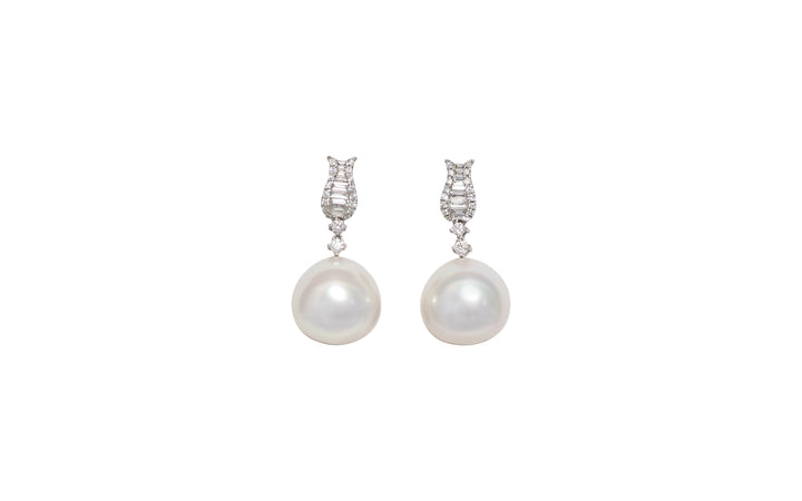 A high button pink white South Sea pearl diamond drop earrings in 18k white gold is displayed on a white background.