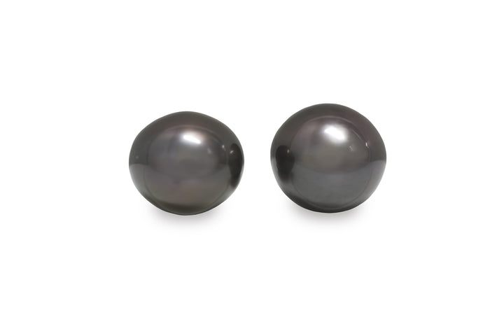 A high button Tahitian pearl pair is displayed on a white background.