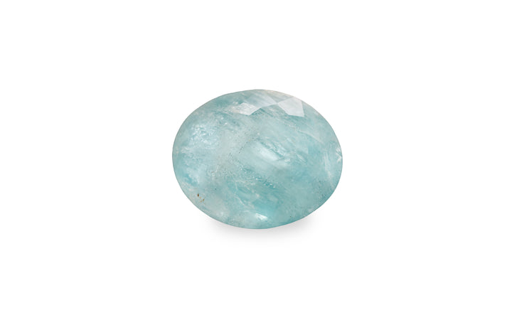 An oval cut aquamarine gemstone is displayed on a white background.
