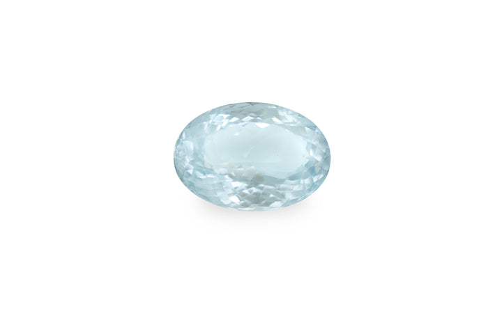 An oval cut aquamarine gemstone is displayed on a white background.