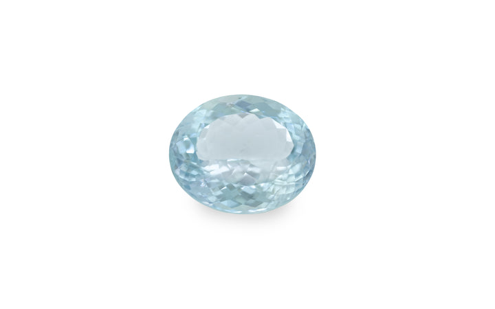 An oval cut aquamarine gemstone is displayed on a white background.