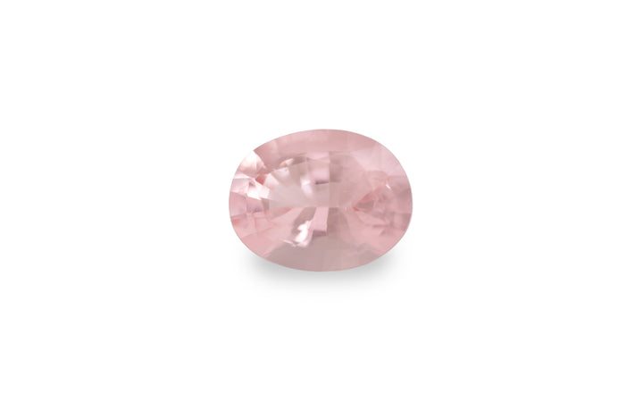 An oval cut pink morganite gemstone is displayed on a white background.