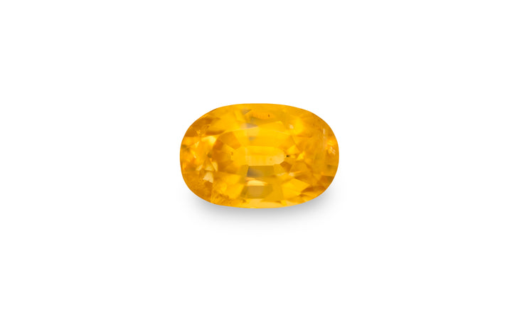  An oval cut yellow sapphire gemstone is displayed on a white background.
