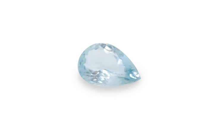 A pear cut aquamarine gemstone is displayed on a white background.