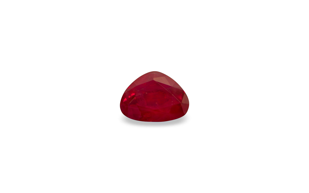 A pear cut Burmese ruby gemstone is displayed on a white background.