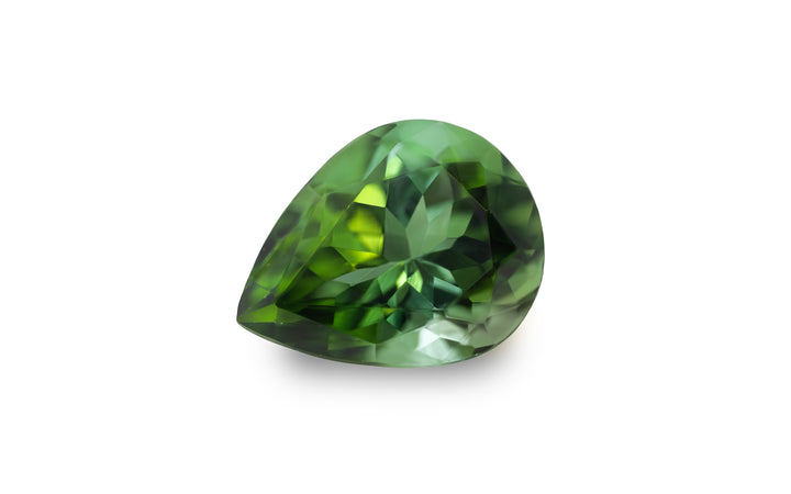 A pear cut green tourmaline gemstone is displayed on a white background.