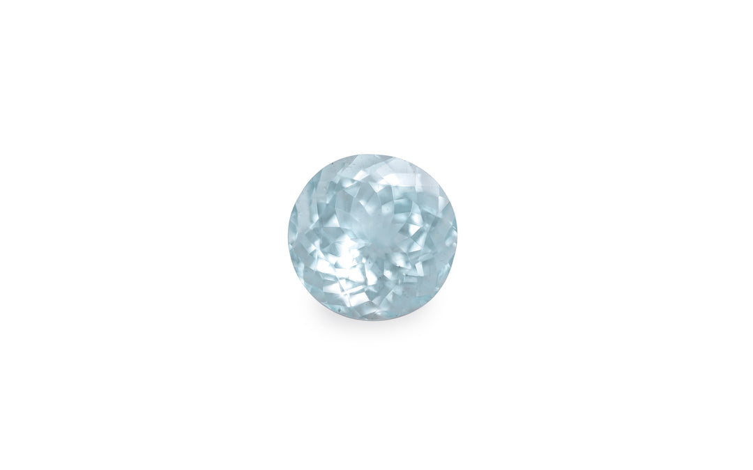 A round brilliant cut aquamarine gemstone is displayed on a white background.