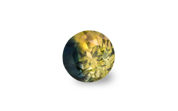 A round cut, bright yellow and blue Australian Parti sapphire is displayed on a white background.