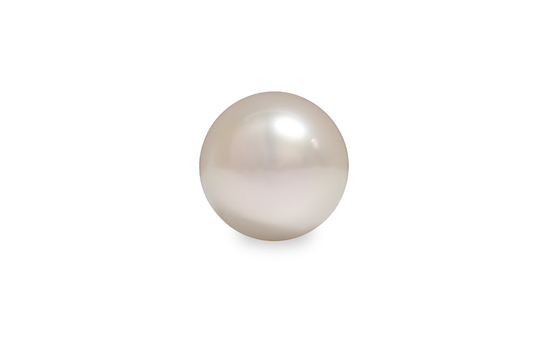 A round shape fancy pink South Sea pearl is displayed on a white background.