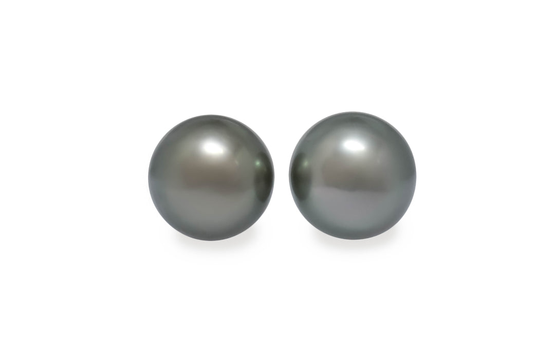A round shape silver green Tahitian pearl pair is displayed on a white background.