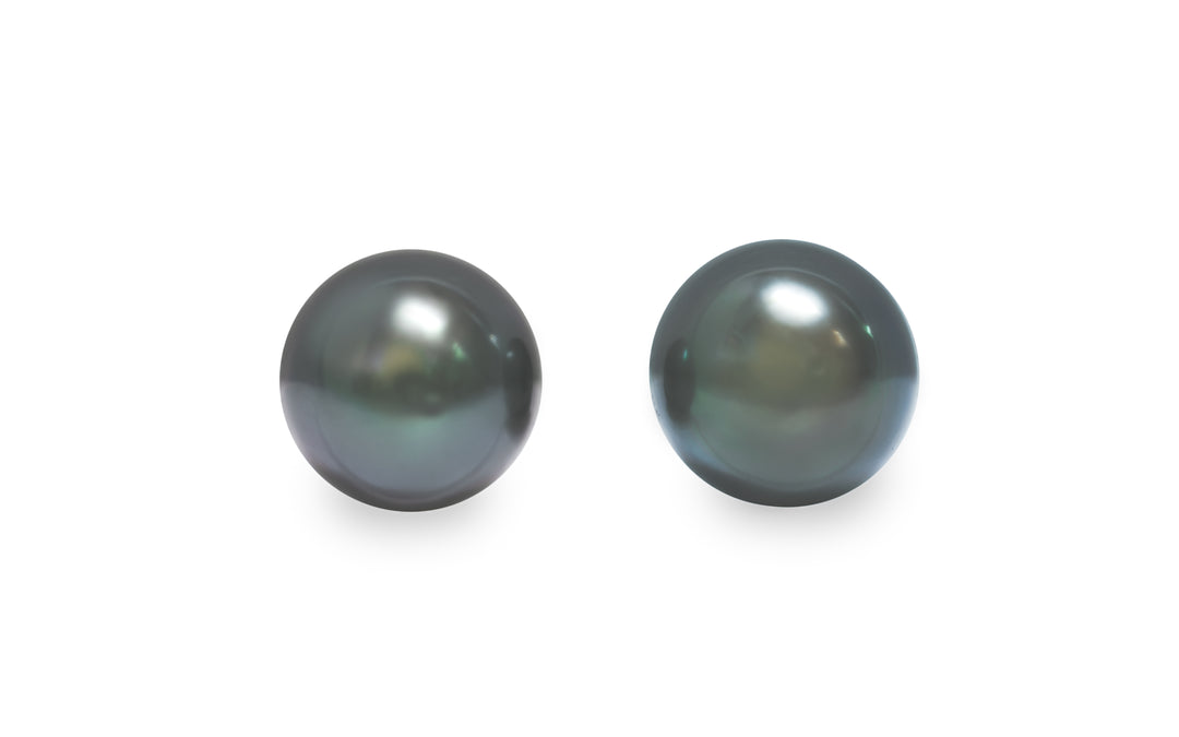 A round shape Tahitian pearl pair is displayed on a white background.