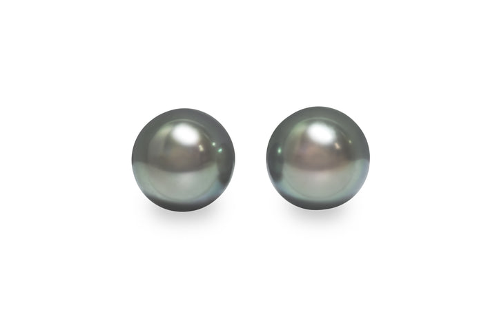 A round shape Tahitian pearl pair is displayed on a white background.