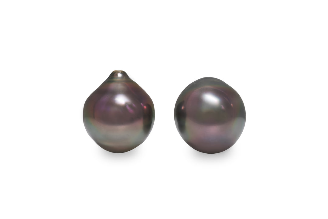 A semi baroque shape Tahitian pearl pair is displayed on a white background.
