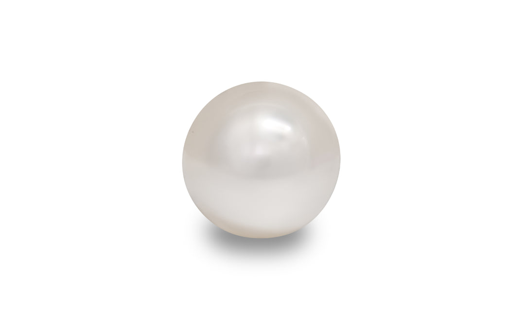 A semi round shape cream white South Sea pearl is displayed on a white background.