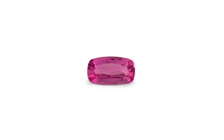 A cushion cut pink Ceylon sapphire gemstone is displayed on a white background.