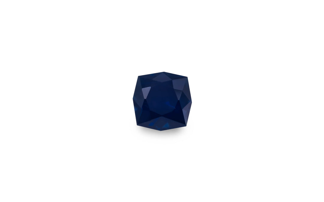 A fancy cut blue Australian sapphire gemstone is displayed on a white background.