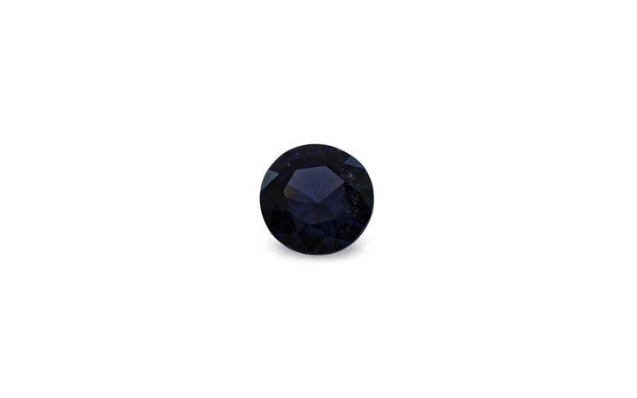 A round brilliant cut blue spinel gemstone is displayed on a white background.