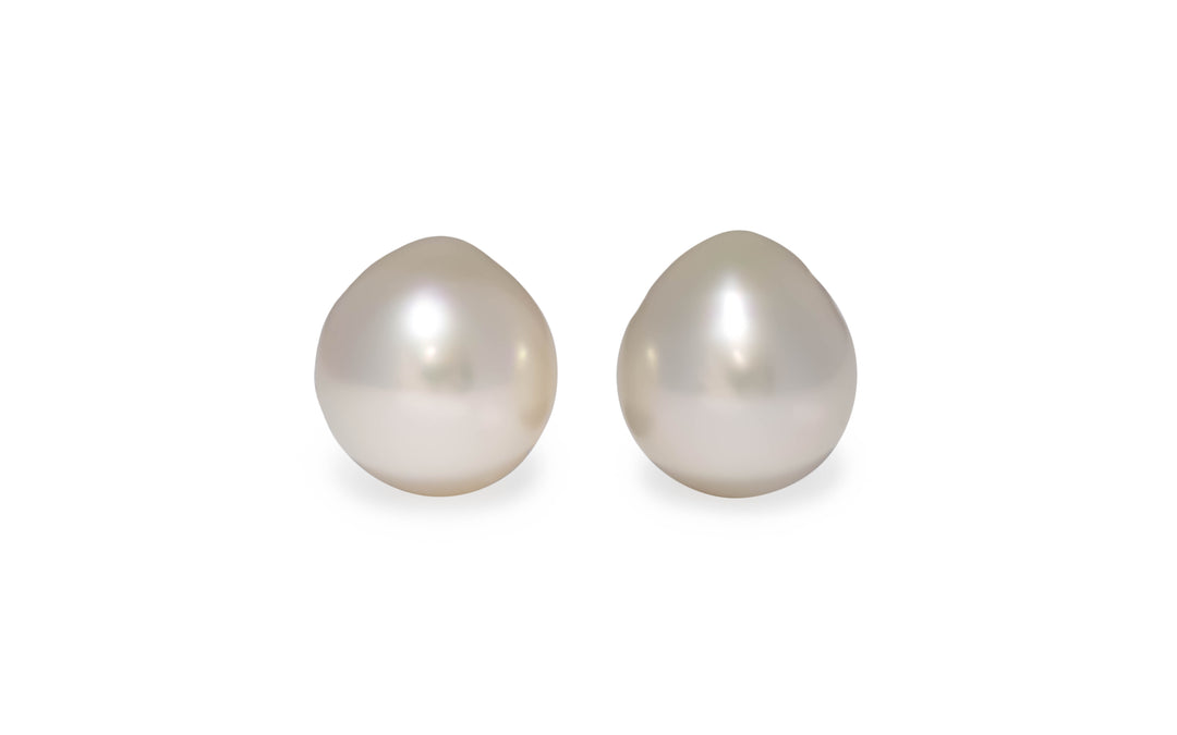 An oval pink/white South Sea pearl pair is displayed on a white background.