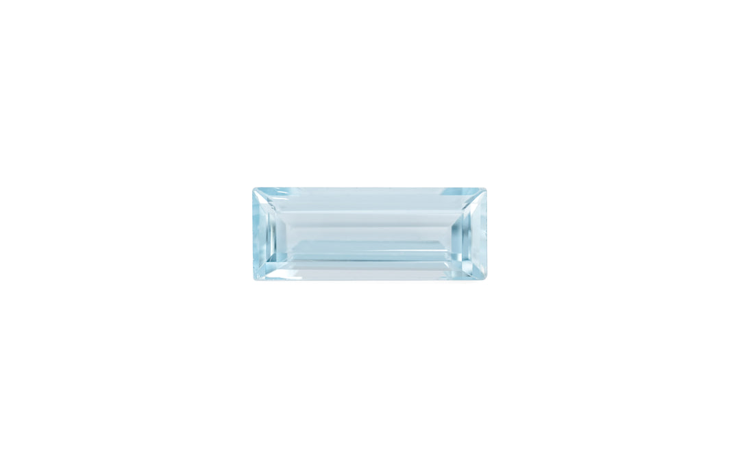 A baguette cut pale blue aquamarine gemstone is displayed on a white background.