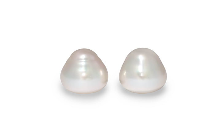 A circle shape white South Sea pearl pair is displayed on a white background.