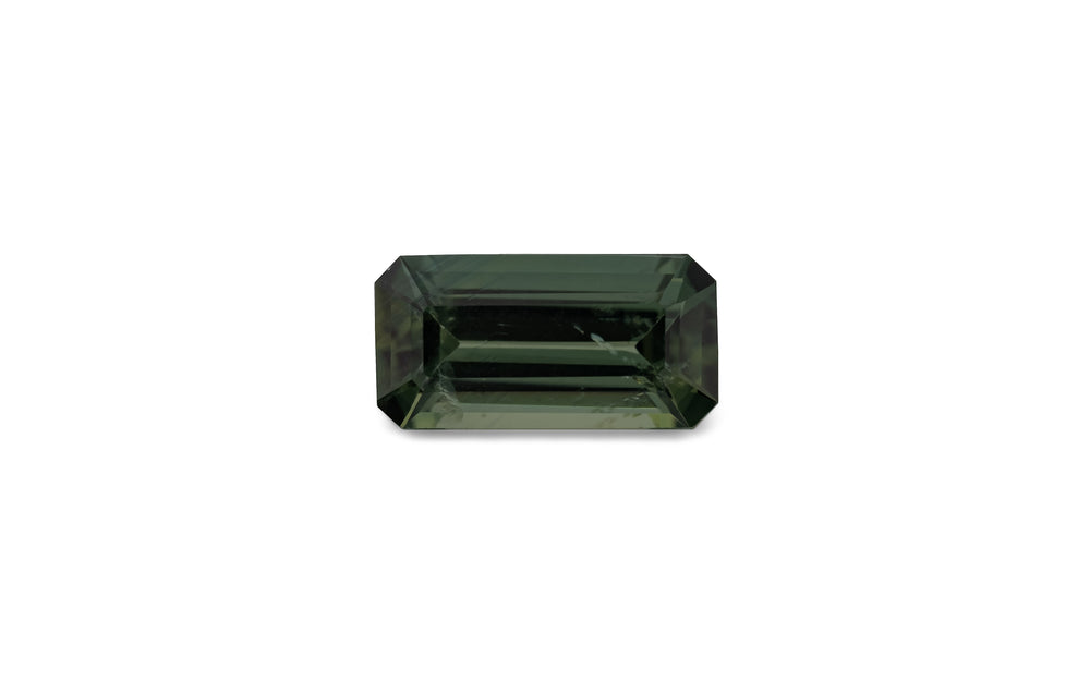 An emerald cut green Australian sapphire gemstone is displayed on a white background.