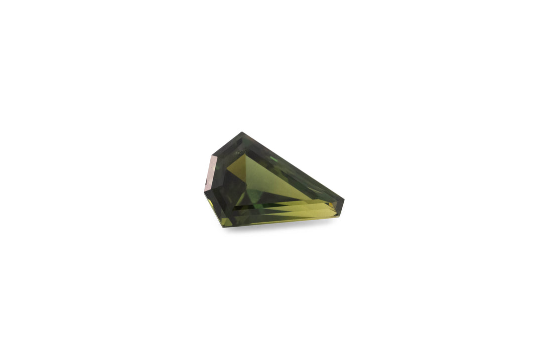 A fancy kite cut green Australian sapphire gemstone is displayed on a white background.