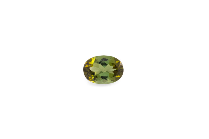 An oval cut green tourmaline gemstone is displayed on a white background.