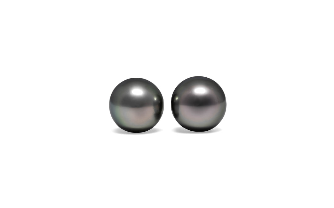 A round pair of green/copper/bronze Tahitian pearls is displayed on a white background.